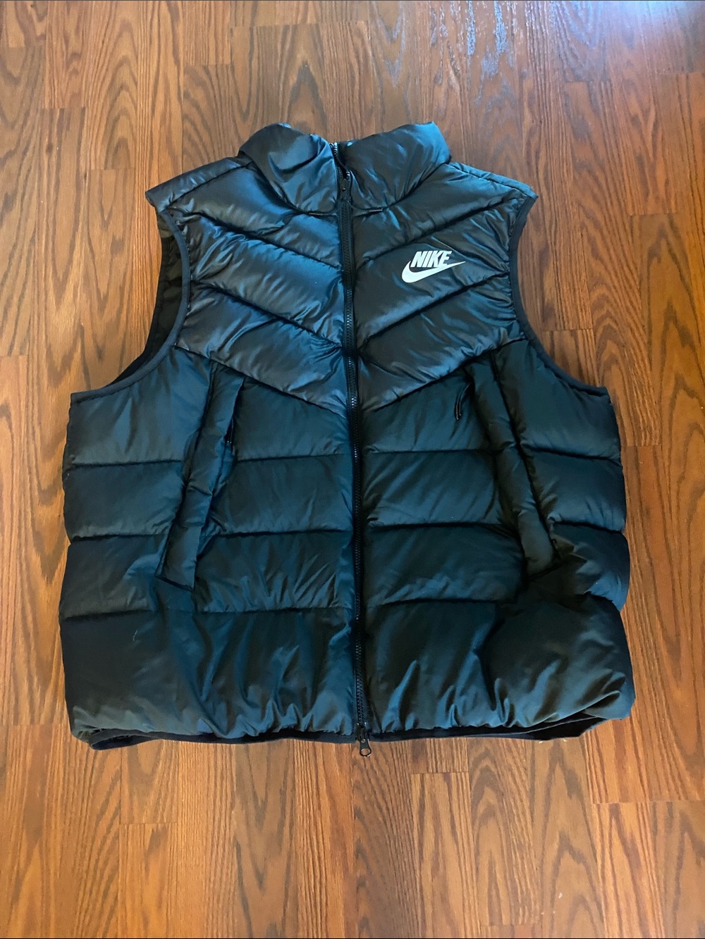Nike men’s black puffer vest.